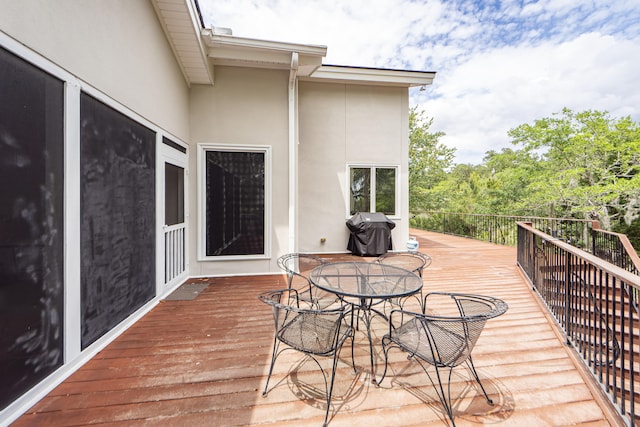 wooden terrace featuring grilling area