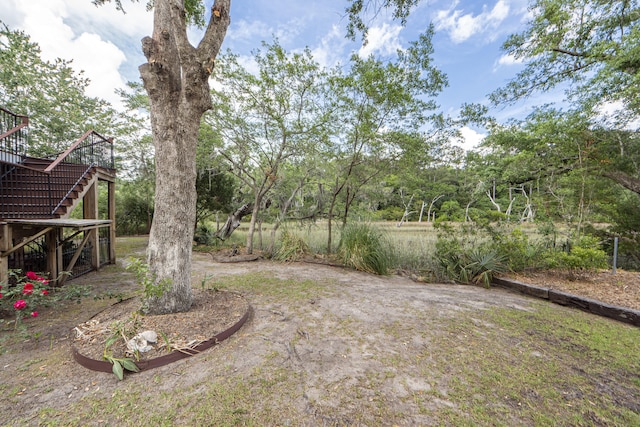 view of yard featuring a wooden deck