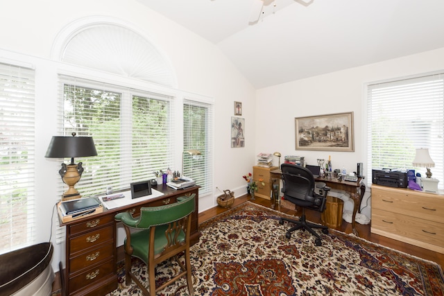 home office featuring plenty of natural light, hardwood / wood-style floors, and vaulted ceiling