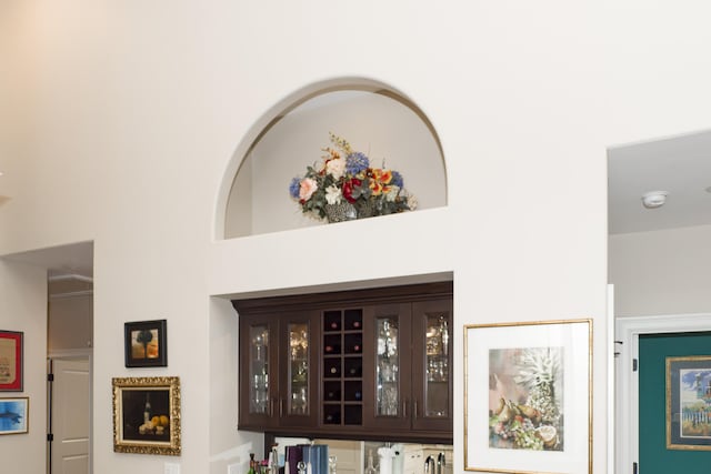 interior space featuring dark brown cabinets and a high ceiling