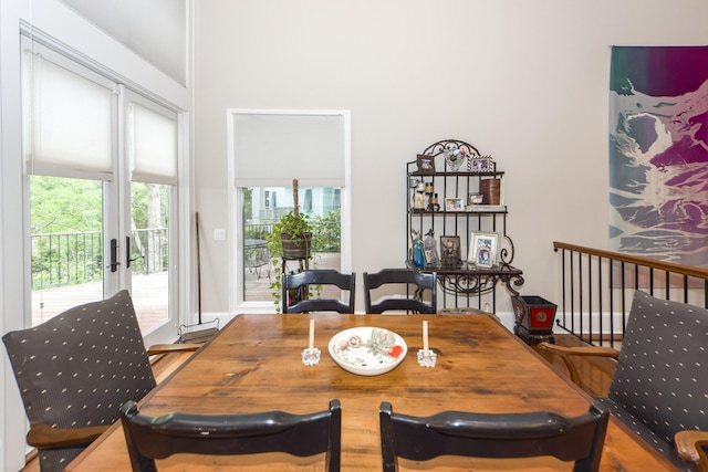 dining space featuring hardwood / wood-style floors and french doors