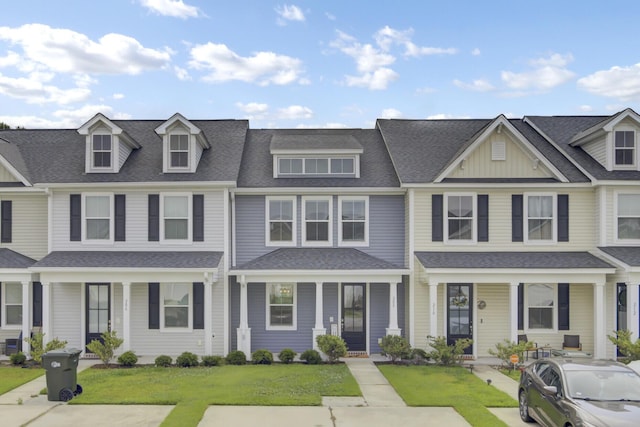 208 Kirkland St, Goose Creek, SC 29445 - view of property featuring a porch, a front lawn, and roof with shingles