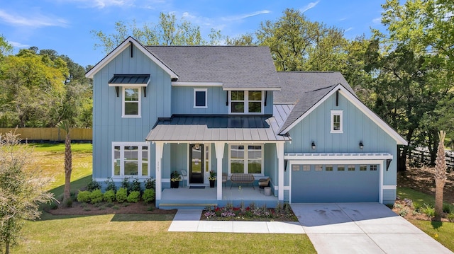 modern farmhouse style home with a porch, a garage, and a front lawn