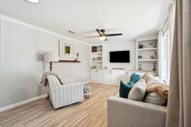 living room featuring ceiling fan, light hardwood / wood-style flooring, and ornamental molding