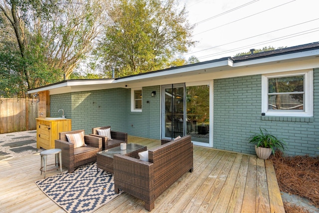 wooden deck with an outdoor hangout area