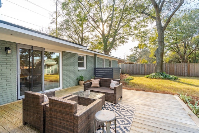 wooden terrace featuring a yard and an outdoor hangout area