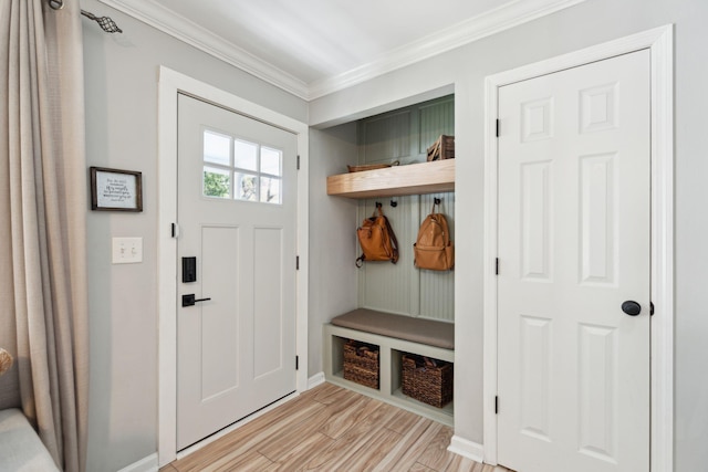 mudroom featuring crown molding