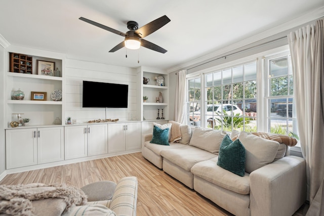 living room featuring light wood-type flooring and ceiling fan