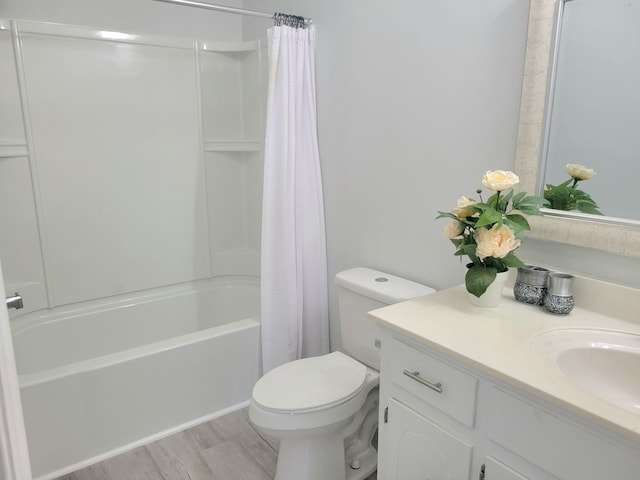 4457 Rice Mill Dr, North Charleston, SC 29420 - full bath featuring vanity, wood finished floors, and shower / bath combo with shower curtain