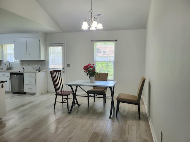 4457 Rice Mill Dr, North Charleston, SC 29420 - dining area featuring a chandelier, healthy amount of natural light, light wood-type flooring, and lofted ceiling