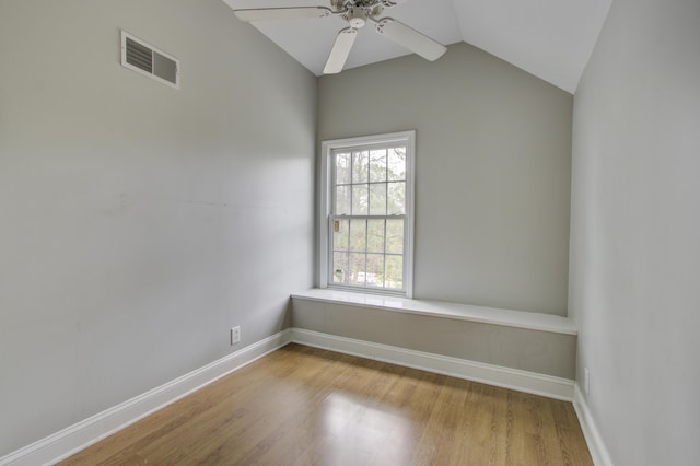 unfurnished room with vaulted ceiling, ceiling fan, and light hardwood / wood-style flooring