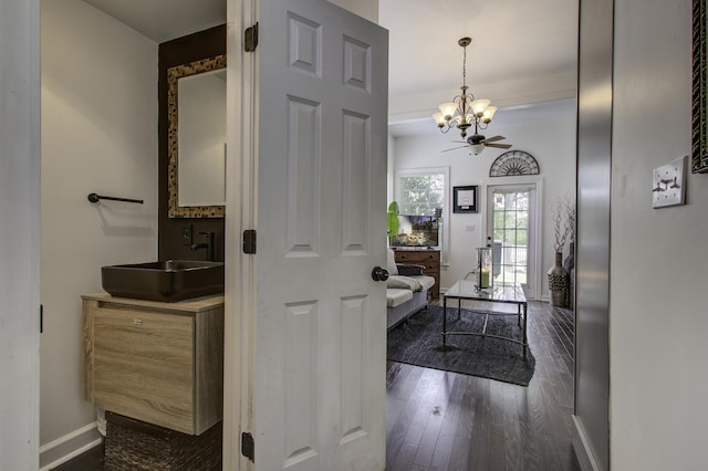 entryway featuring sink, ceiling fan with notable chandelier, and dark hardwood / wood-style flooring