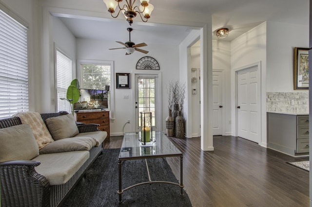 living room featuring dark hardwood / wood-style flooring and ceiling fan