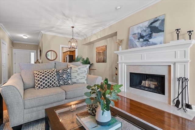 living room featuring an inviting chandelier and crown molding