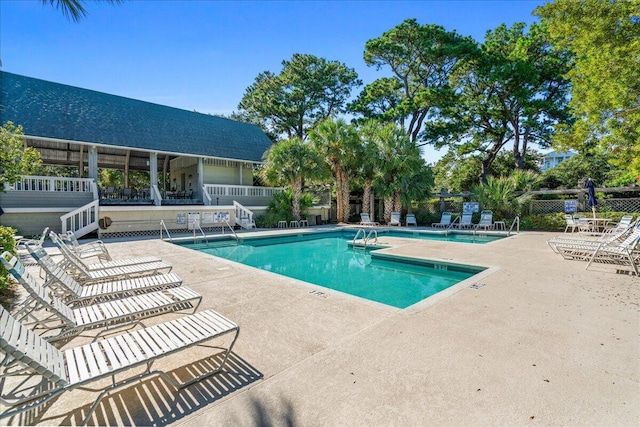 view of swimming pool featuring a patio area