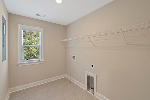 washroom with light tile patterned floors, hookup for an electric dryer, and washer hookup