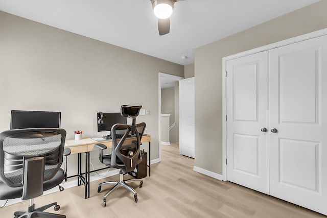office featuring baseboards, ceiling fan, and wood finished floors