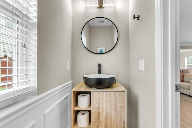 bathroom with vanity and wood finished floors