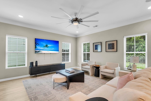 living room with light wood-type flooring, recessed lighting, and a ceiling fan