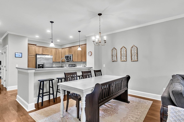 622 Windermere Blvd Unit D, Charleston, SC 29407 - dining room with ornamental molding, baseboards, a chandelier, wood finished floors, and recessed lighting