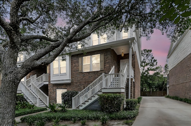 622 Windermere Blvd Unit D, Charleston, SC 29407 - view of property with stairs, brick siding, and concrete driveway