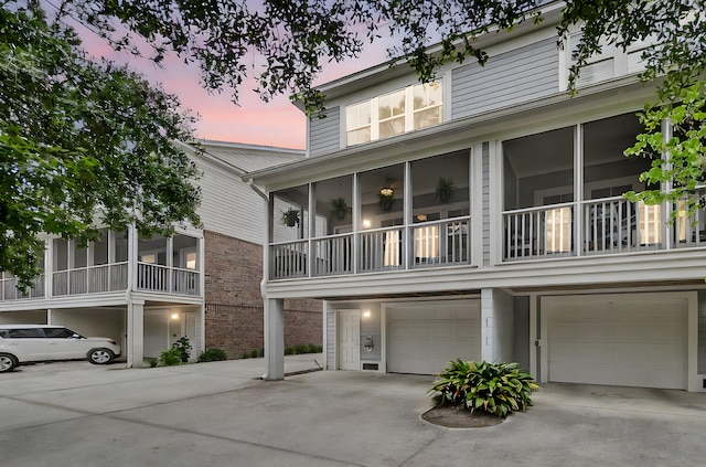 622 Windermere Blvd Unit D, Charleston, SC 29407 - view of front facade featuring a garage, brick siding, and driveway