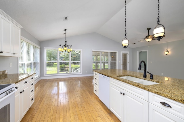 kitchen featuring a sink, light wood-type flooring, white appliances, and ceiling fan with notable chandelier