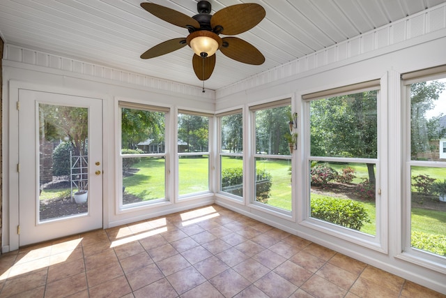 unfurnished sunroom featuring tile patterned flooring