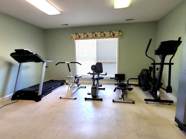exercise room featuring baseboards and visible vents