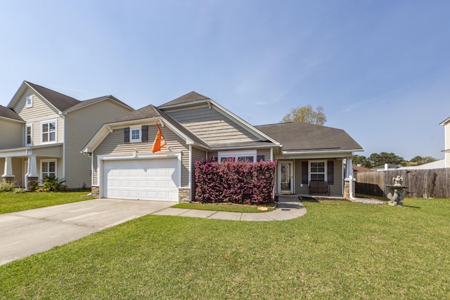 view of front of home with a front yard and a garage