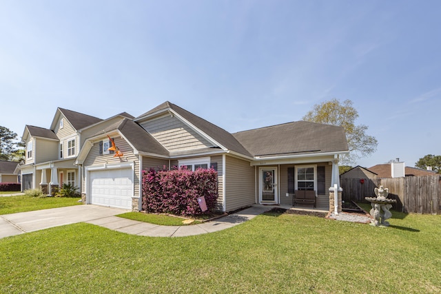 view of front of house featuring a front yard and a garage