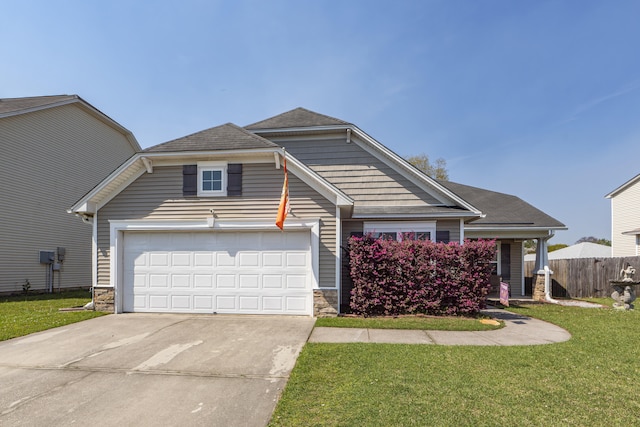 view of front of house featuring a front lawn and a garage