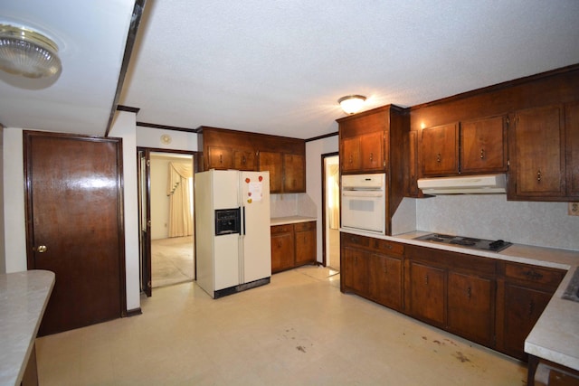 kitchen with white appliances, crown molding, and tasteful backsplash