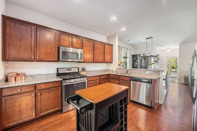 1723 Indaba Way, Charleston, SC 29414 - kitchen with appliances with stainless steel finishes, a peninsula, a sink, recessed lighting, and dark wood-style flooring