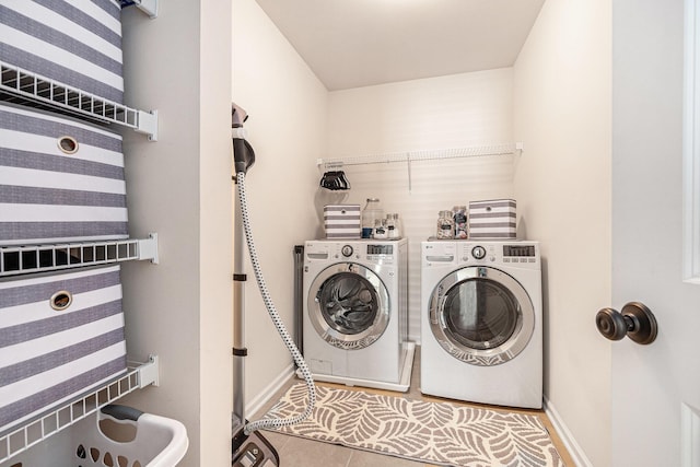 1723 Indaba Way, Charleston, SC 29414 - clothes washing area featuring washer and clothes dryer, tile patterned flooring, and baseboards