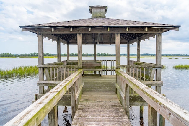 dock area with a gazebo and a water view