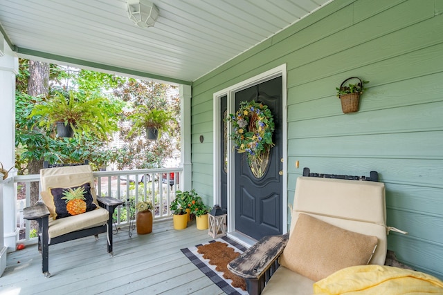 doorway to property with a porch