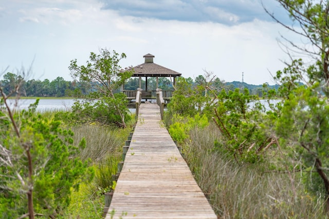 dock area featuring a gazebo and a water view