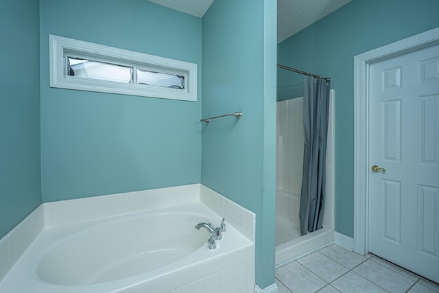 105 Northpark Ave, Summerville, SC 29485 - bathroom featuring a stall shower, a bath, tile patterned floors, and a textured ceiling