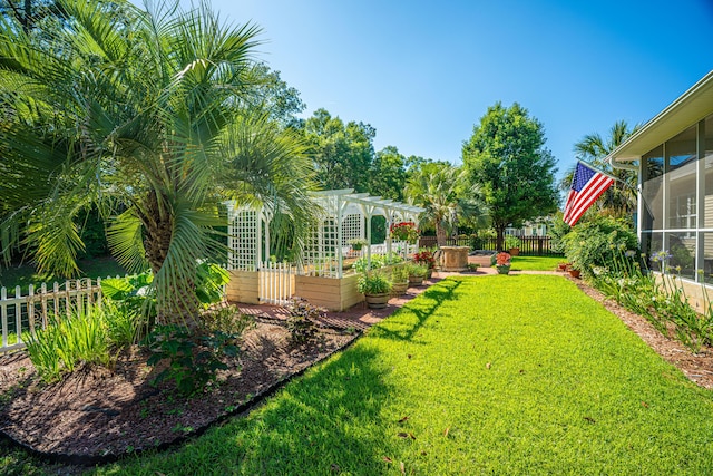 105 Northpark Ave, Summerville, SC 29485 - view of yard featuring a sunroom, a garden, and a pergola
