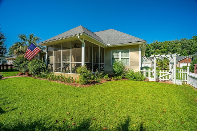 105 Northpark Ave, Summerville, SC 29485 - back of property with a sunroom, a shingled roof, and ceiling fan