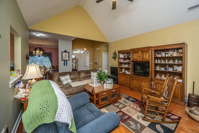 105 Northpark Ave, Summerville, SC 29485 - living room featuring a chandelier, a ceiling fan, light wood-style flooring, and high vaulted ceiling