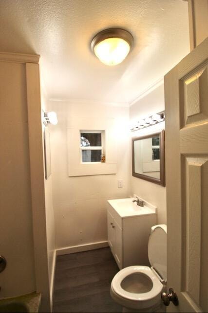 1925 Kerry St, North Charleston, SC 29406 - bathroom with toilet, ornamental molding, wood finished floors, vanity, and baseboards