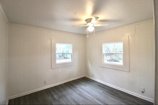 1925 Kerry St, North Charleston, SC 29406 - spare room with dark wood-type flooring, crown molding, baseboards, and a ceiling fan
