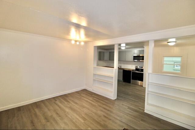1925 Kerry St, North Charleston, SC 29406 - empty room featuring dark wood-style flooring and baseboards