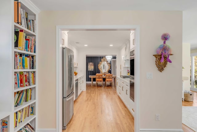 hall featuring light wood-style flooring