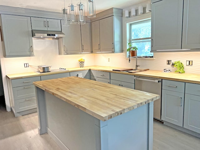 1014 E Cooper Ave, Folly Beach, SC 29439 - kitchen featuring butcher block counters, extractor fan, stainless steel dishwasher, and gray cabinetry