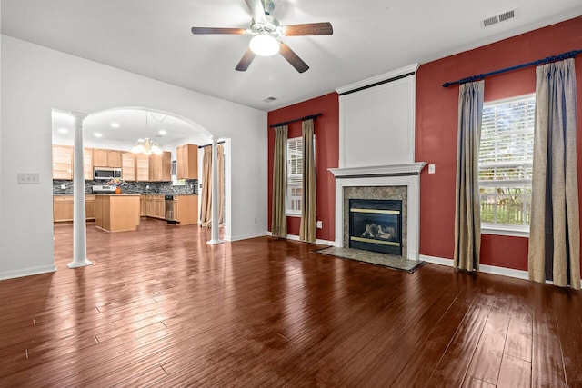 5404 Red Fork Ln, North Charleston, SC 29420 - unfurnished living room with a ceiling fan, a high end fireplace, dark wood-style floors, and baseboards