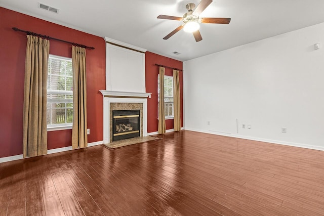 5404 Red Fork Ln, North Charleston, SC 29420 - unfurnished living room with wood finished floors, healthy amount of natural light, a ceiling fan, and a fireplace