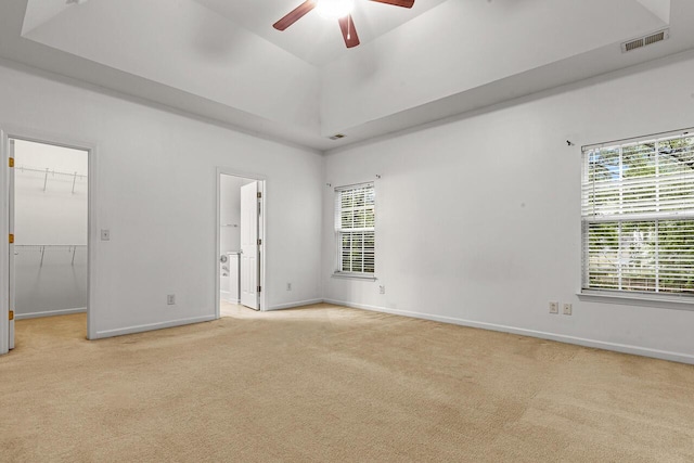 5404 Red Fork Ln, North Charleston, SC 29420 - unfurnished bedroom with light colored carpet, a spacious closet, a raised ceiling, and baseboards